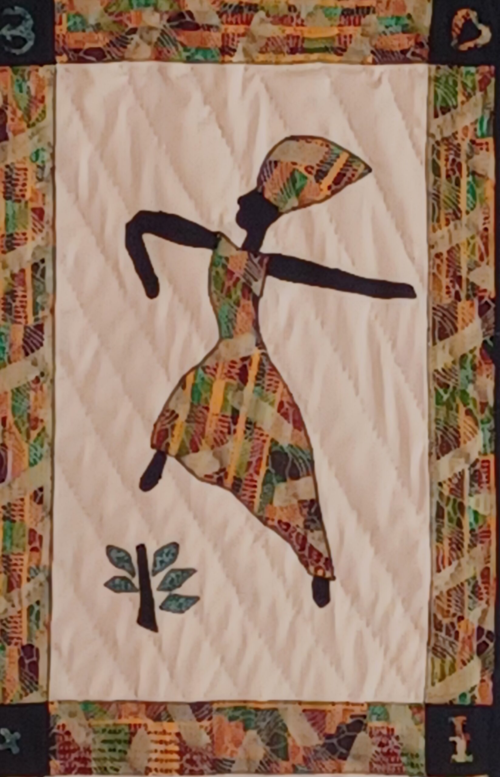 Quilted fiber art titled 'Joy' from the Dancing Ladies Collection, depicting a lively silhouette in mid-dance, celebrating happiness and cultural heritage.