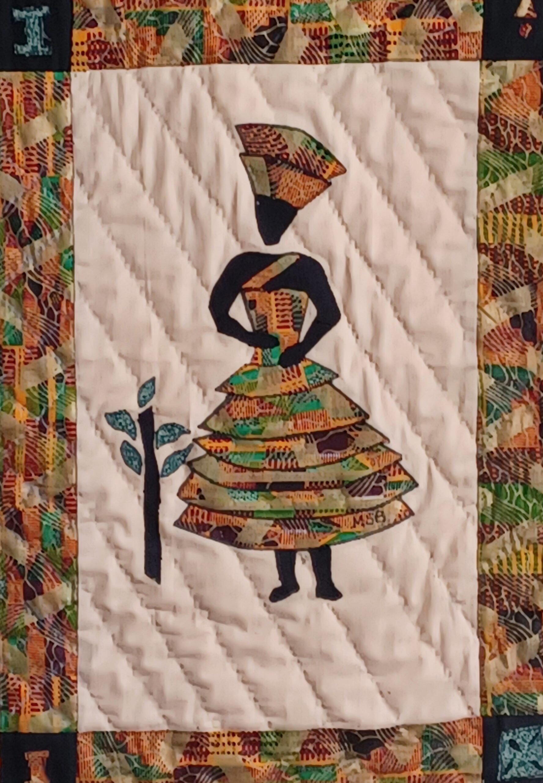 Quilted artwork titled 'Serenity' from the Dancing Ladies Collection, showcasing a poised silhouette exuding calmness and balance.