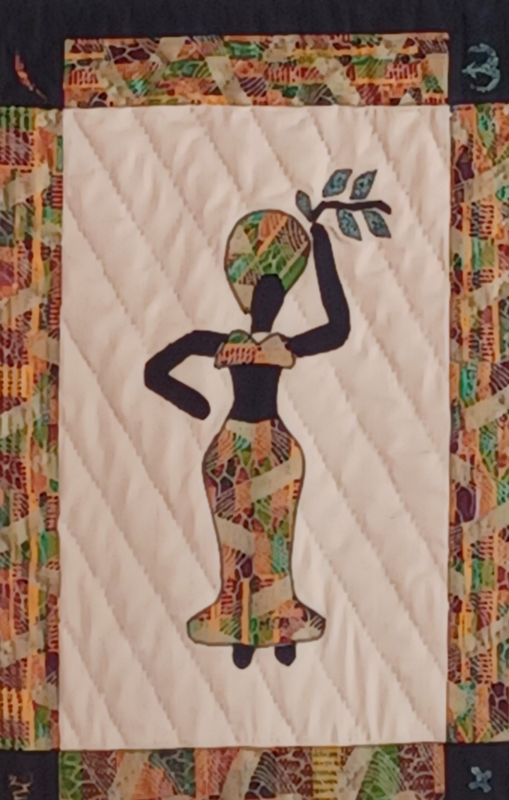 Quilted fiber artwork titled 'Wisdom' from the Dancing Ladies Collection, depicting a figure in deep contemplation, representing knowledge and cultural heritage.