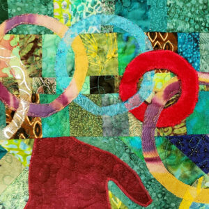Alt Text: Fiber art quilt with overlapping colorful circles stitched onto a green fabric patchwork background. Caption: ‘Circle Connections‘ adds bold symbolism to offices, libraries, and family spaces where connection and creativity thrive.