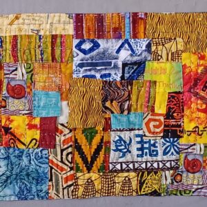 Fiber art quilt featuring colorful batik fabrics and African-inspired textile patterns in a patchwork collage.